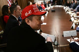 Elon Musk listens during a cabinet meeting with President Donald Trump in the White House